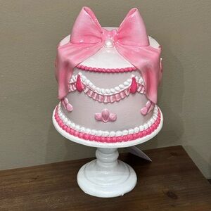 Cupcakes and cashmere pink bow cake